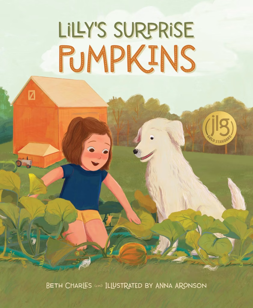 Lilly and her dog are sitting in the middle of the pumpkin patch with an orange barn in the background